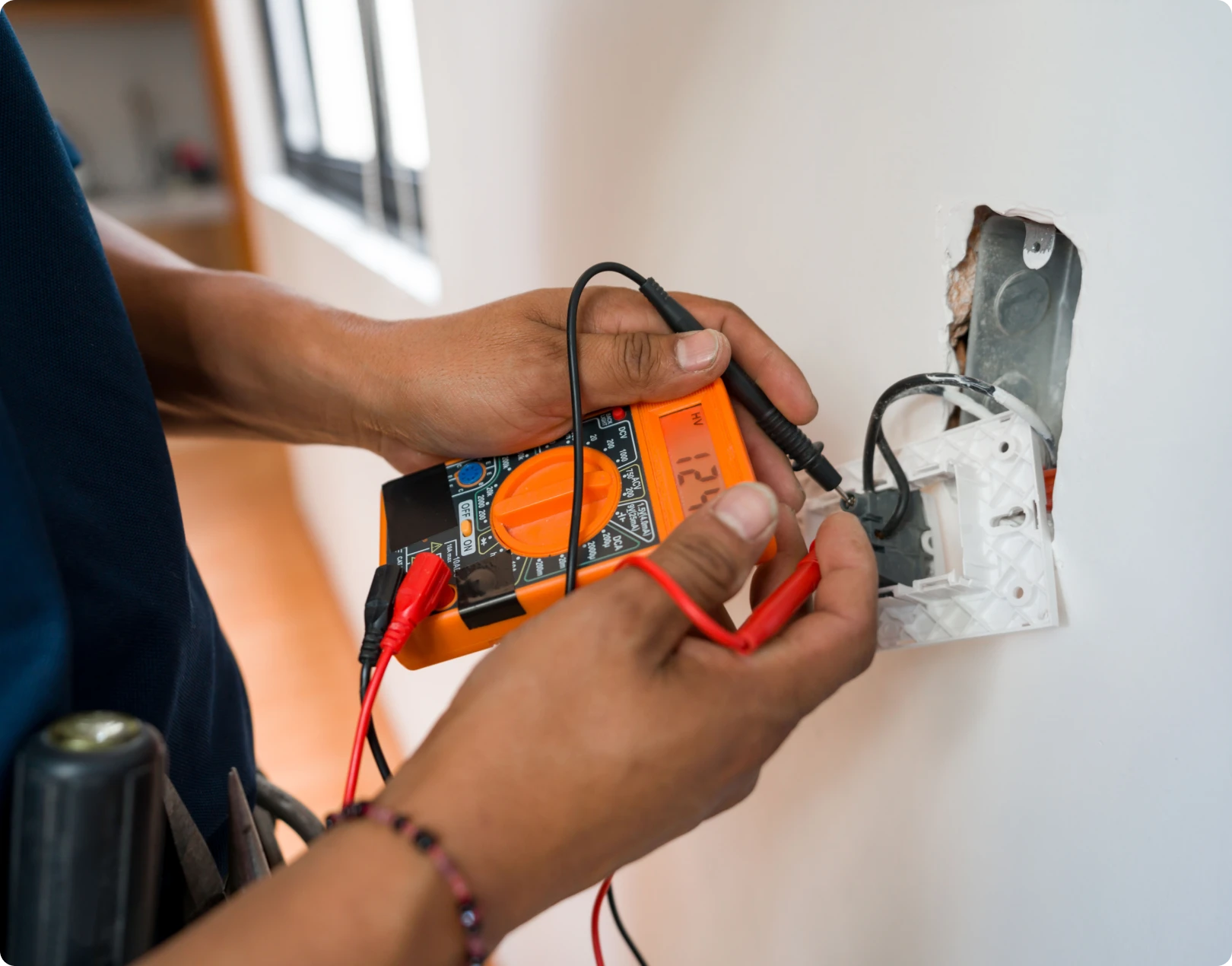 Testing electrical outlet with a multimeter