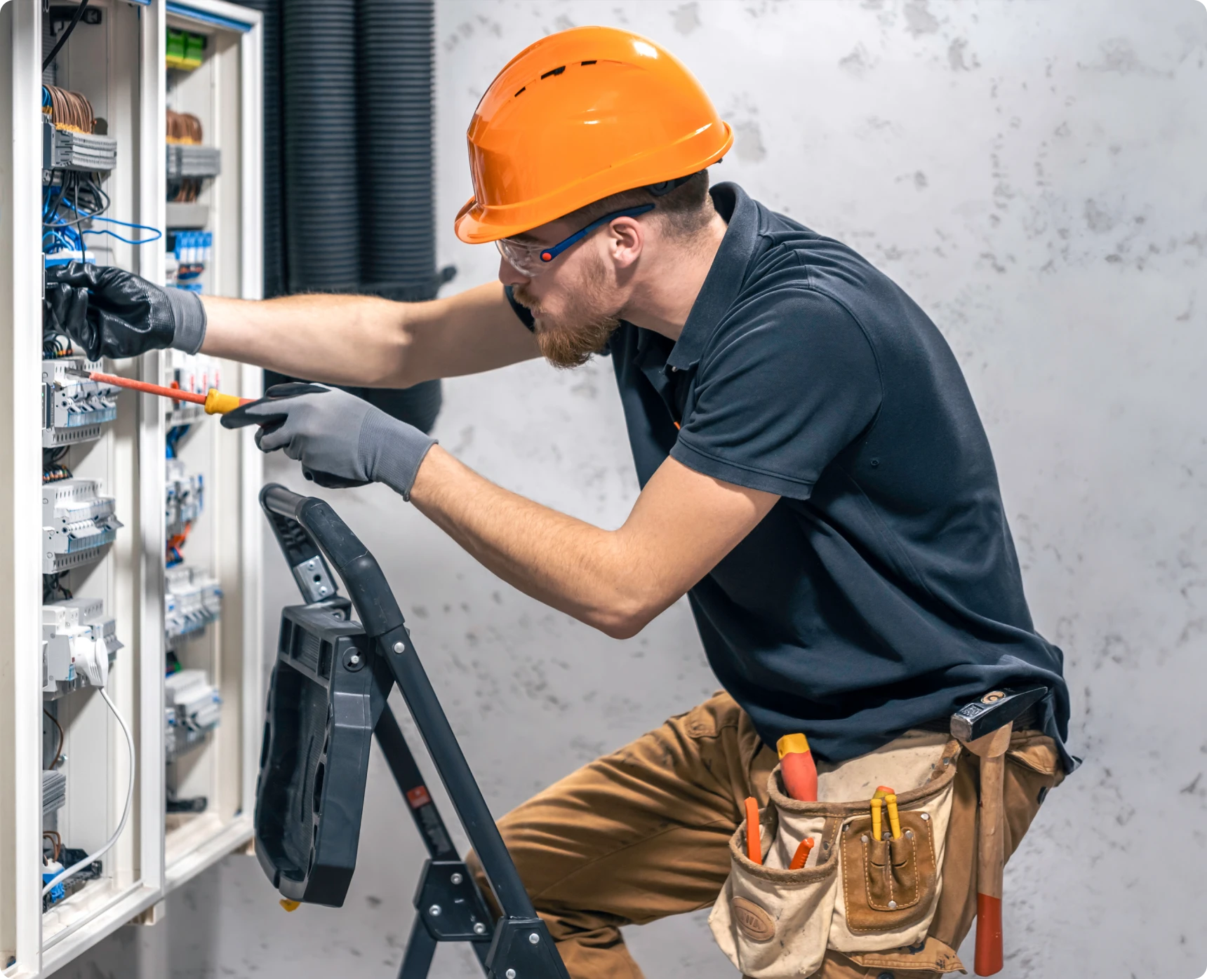 Electrician working on a circuit panel