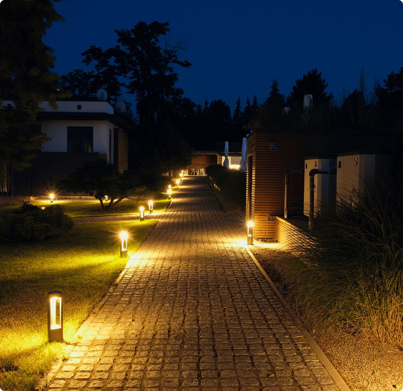 Nighttime garden walkway with soft lighting