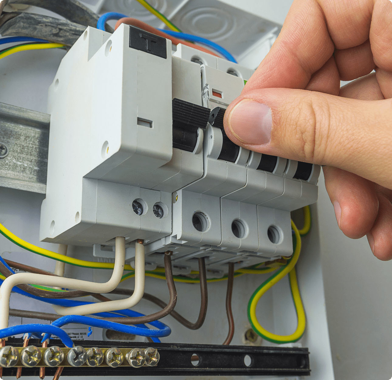 Person switching electrical breaker off