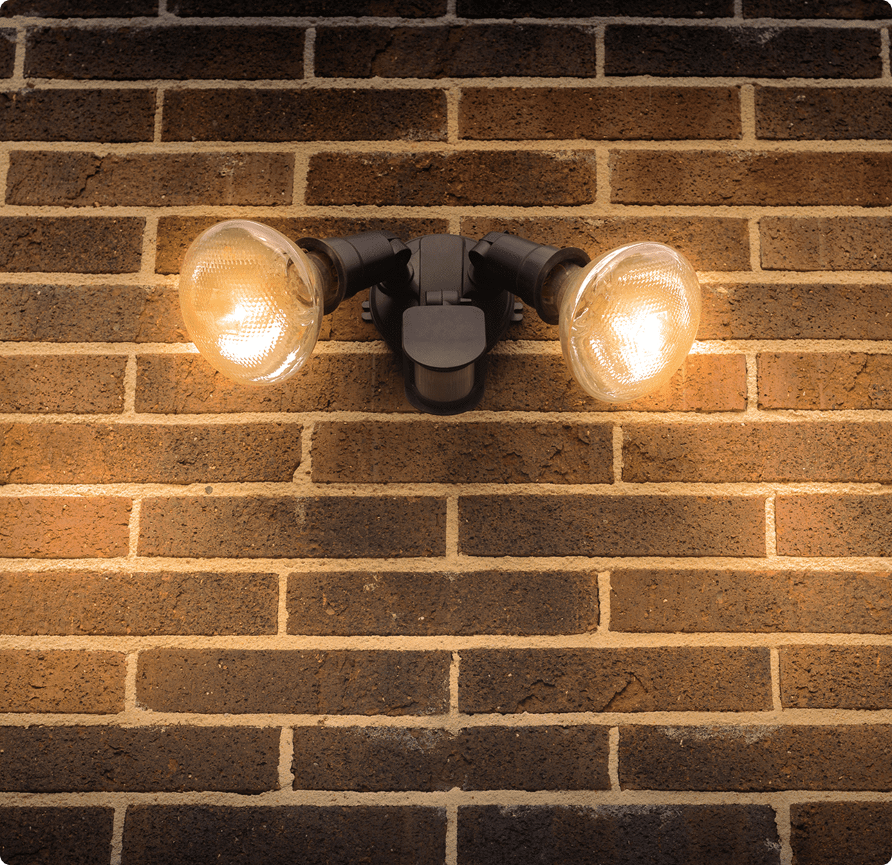 Illuminated dual lights on brick surface