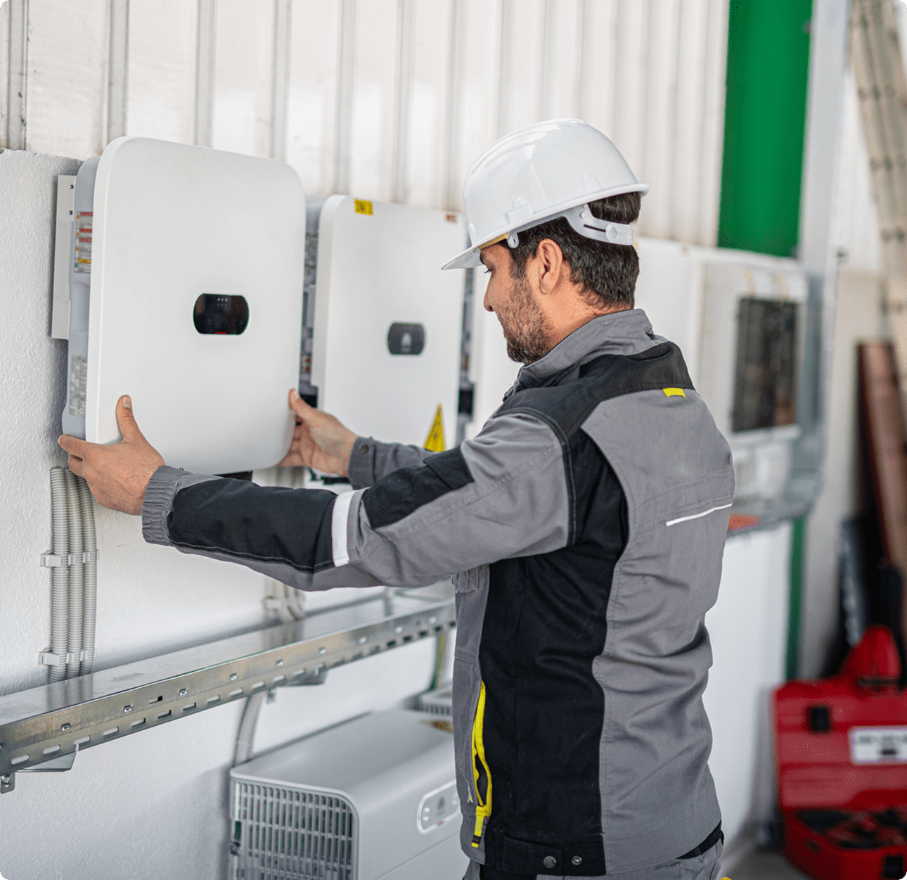 Worker adjusting solar inverter panel