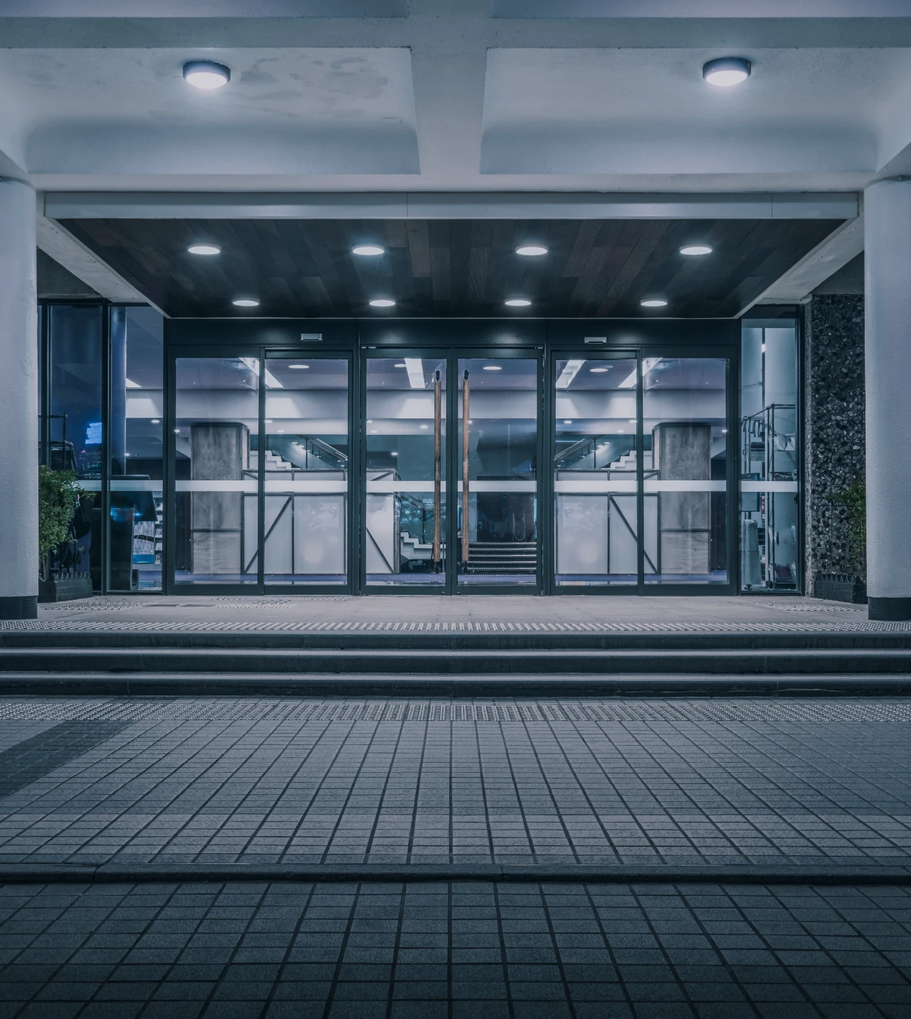 Illuminated office entrance with steps