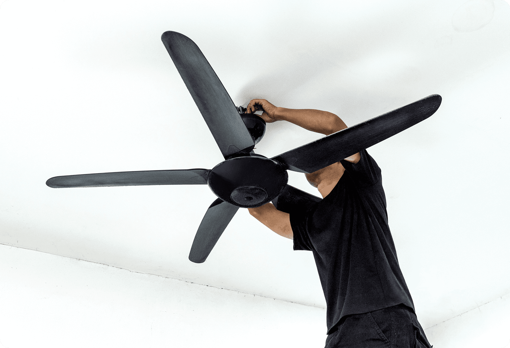 Person fixing ceiling fan